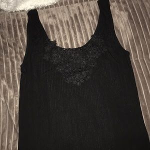 Super cute black tank top with floral details